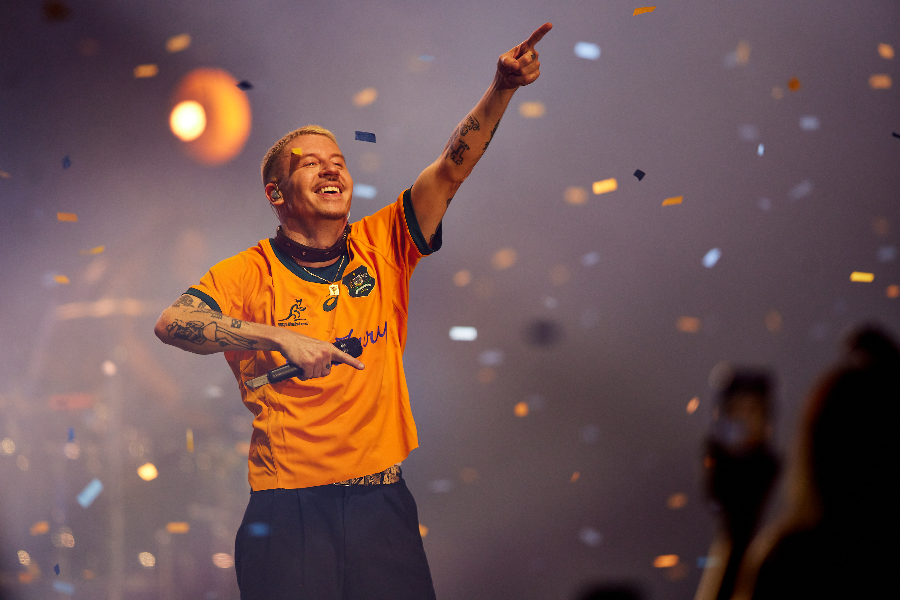 A photo of performer Mackelmore on stage at Perth HPC