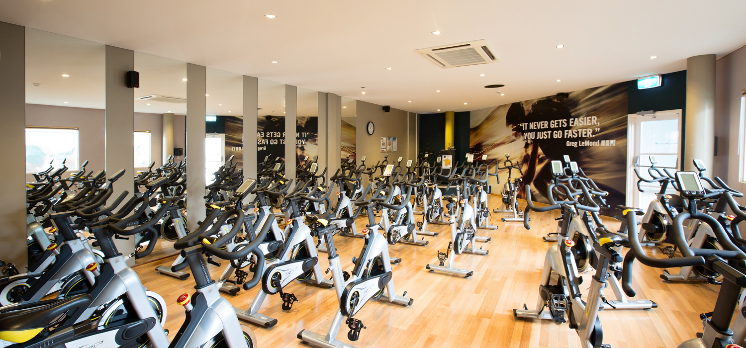 A photo of dozens of stationary bikes inside a fitness room at Perth HPC