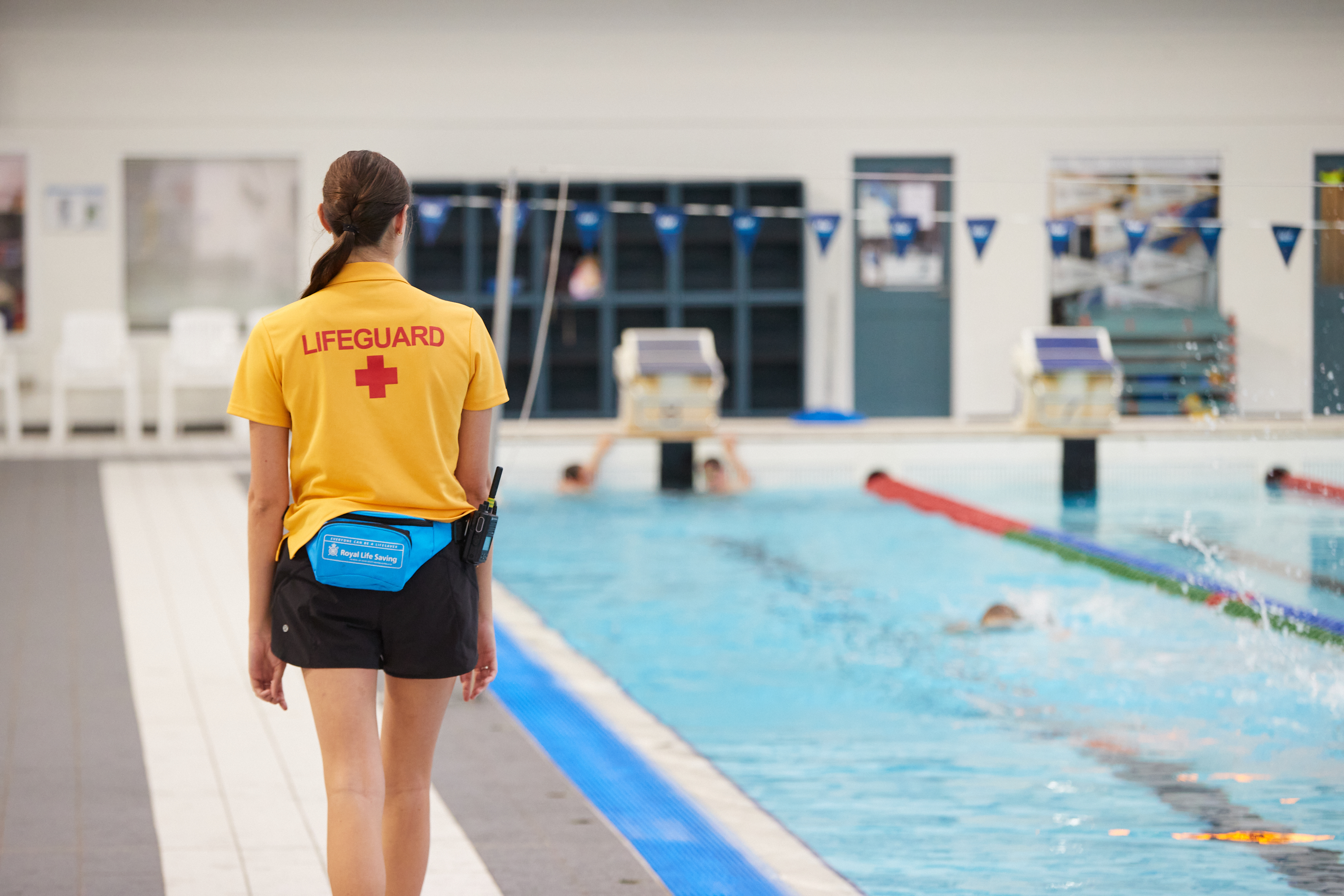 Perth HPC lifeguard patrolling the indoor 8 lane pool