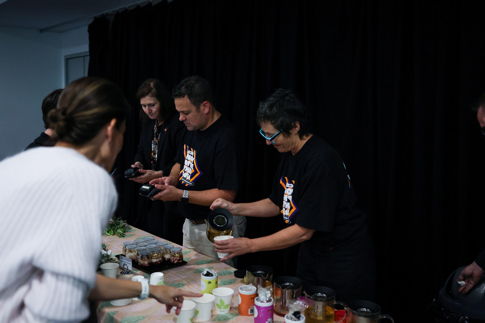 A photo of people being served morning tea