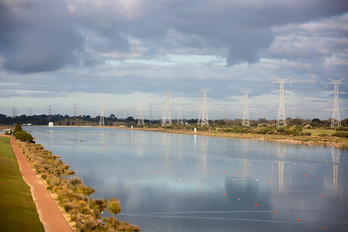 A photo of the water around the Champion Lakes Regatta Centre divided into eight lanes for racing conditions