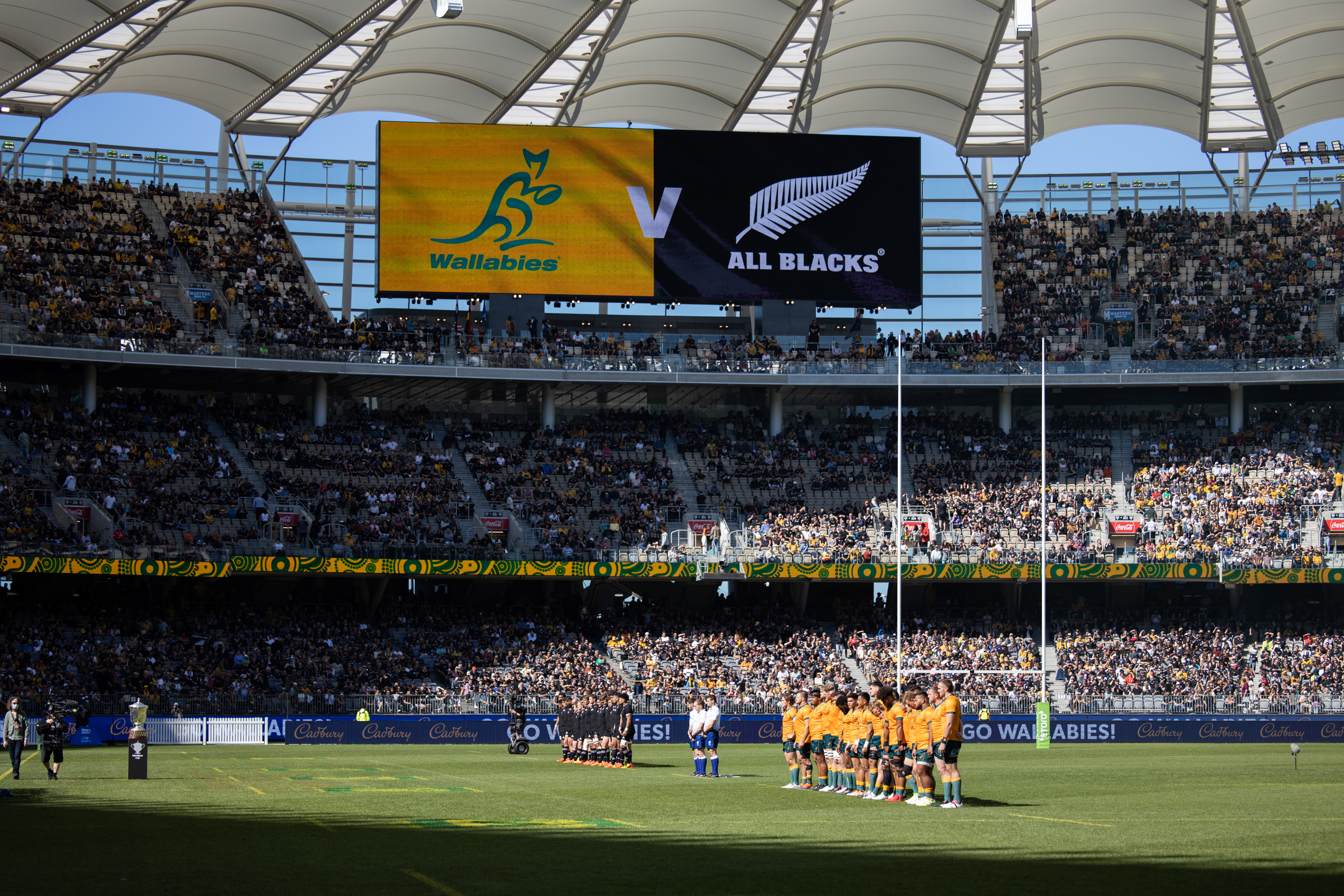 A photo of players lined up on the field at Optus Stadium before a Bledisloe Cup game
