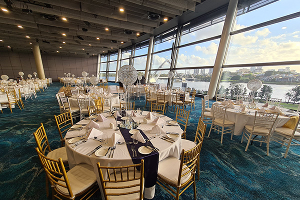Photo of circular tables set up in a function  room at Optus Stadium in Burswood, Perth