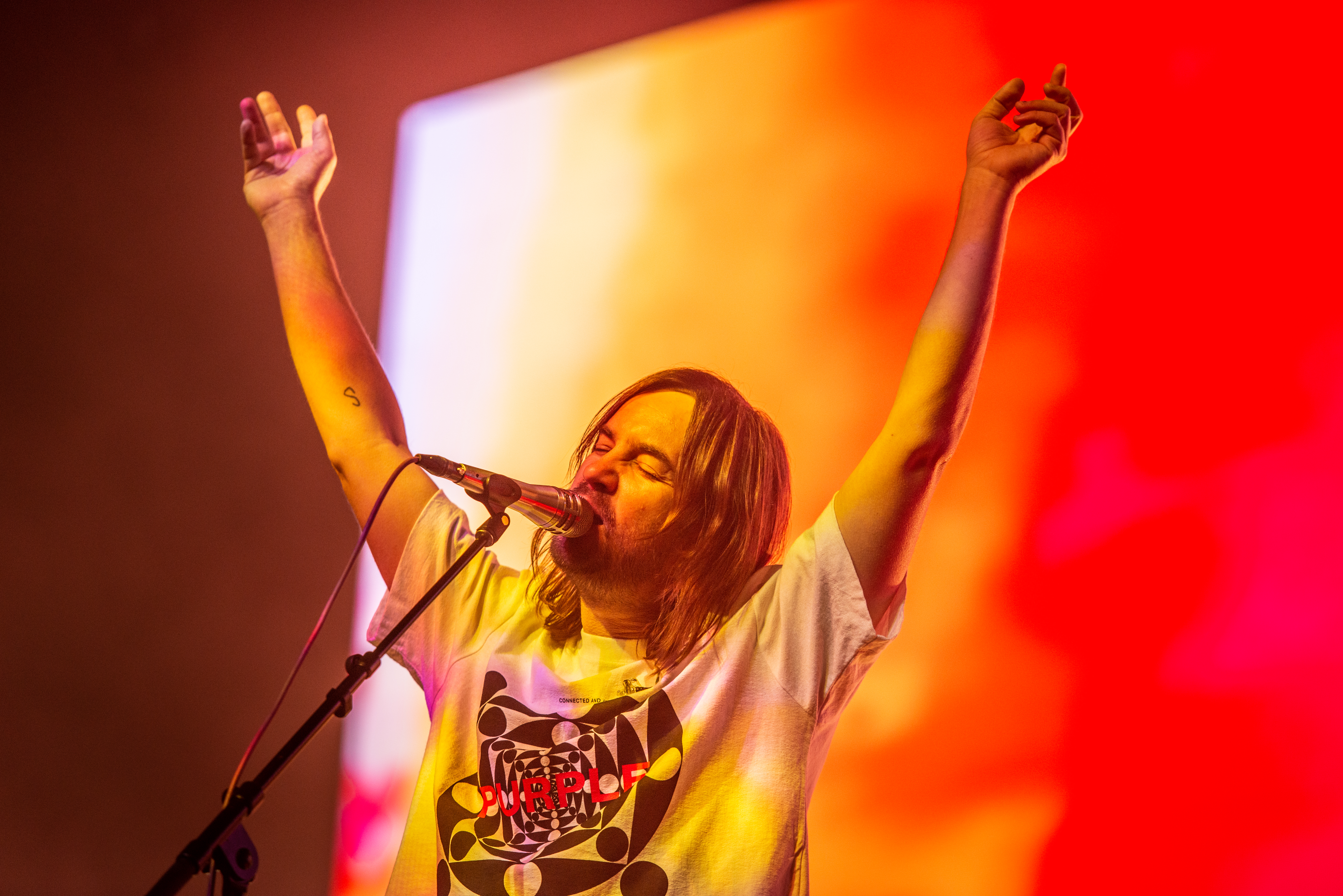 A photo of the singer of Tame Impala performing at RAC Arena in Perth