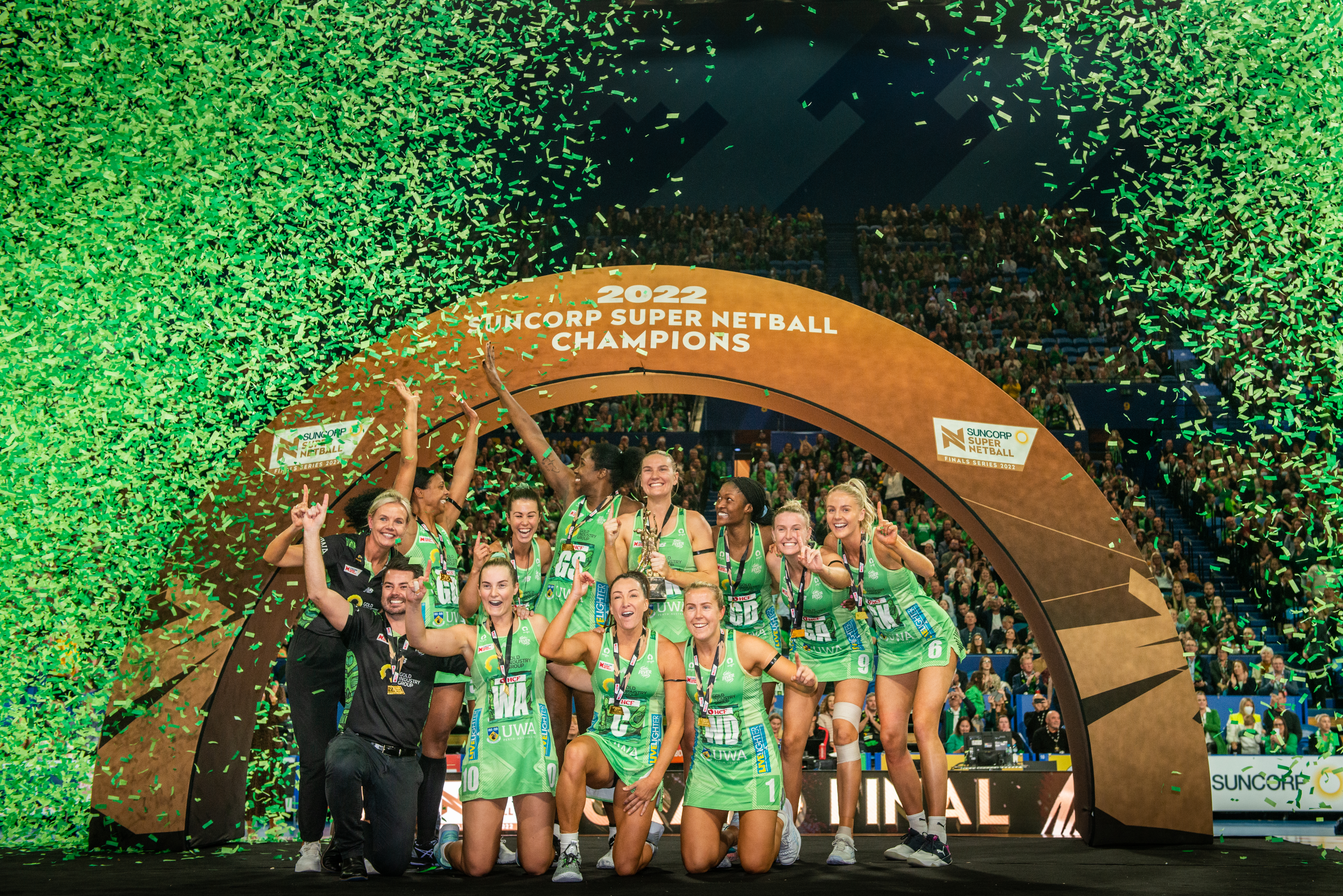 A photo taken of the Super Netball team the West Coast Fever celebrating the championship at RAC Arena in Perth