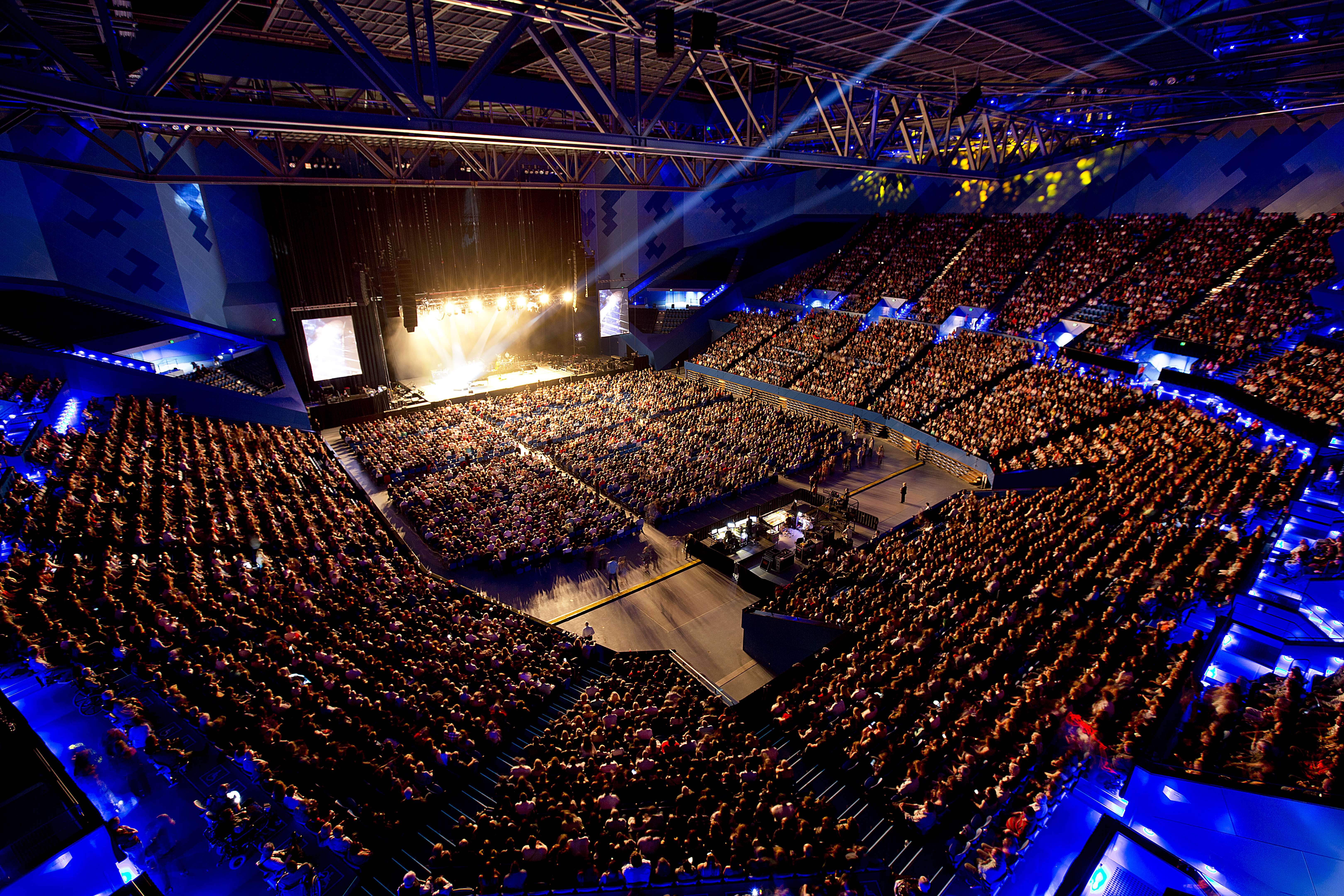 A high up photo from the crowd showing Elton John performing at RAC Arena in Perth