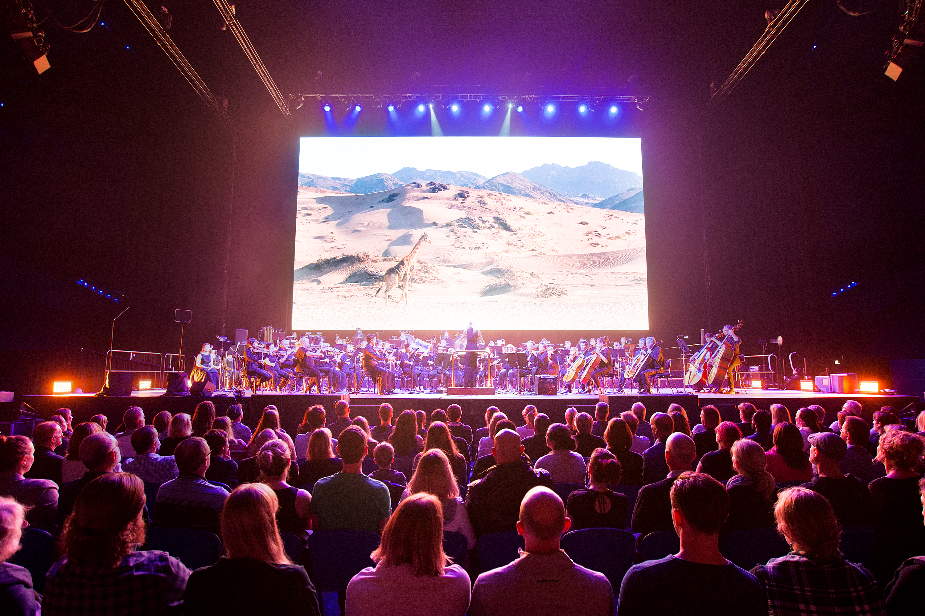 A photo of the crowd watching the orchestra play along with the Planet Earth Live performance at RAC Arena in Perth
