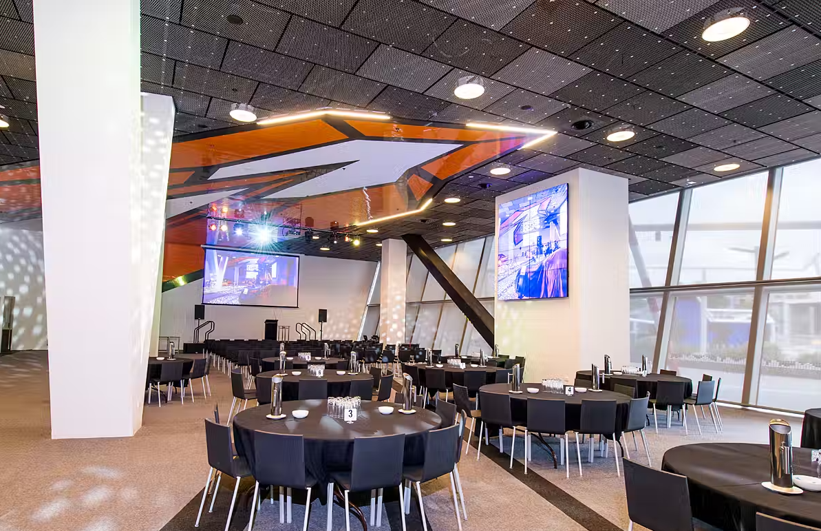 A photo of tabes and chairs set up in the Granite Room at RAC Arena in Perth