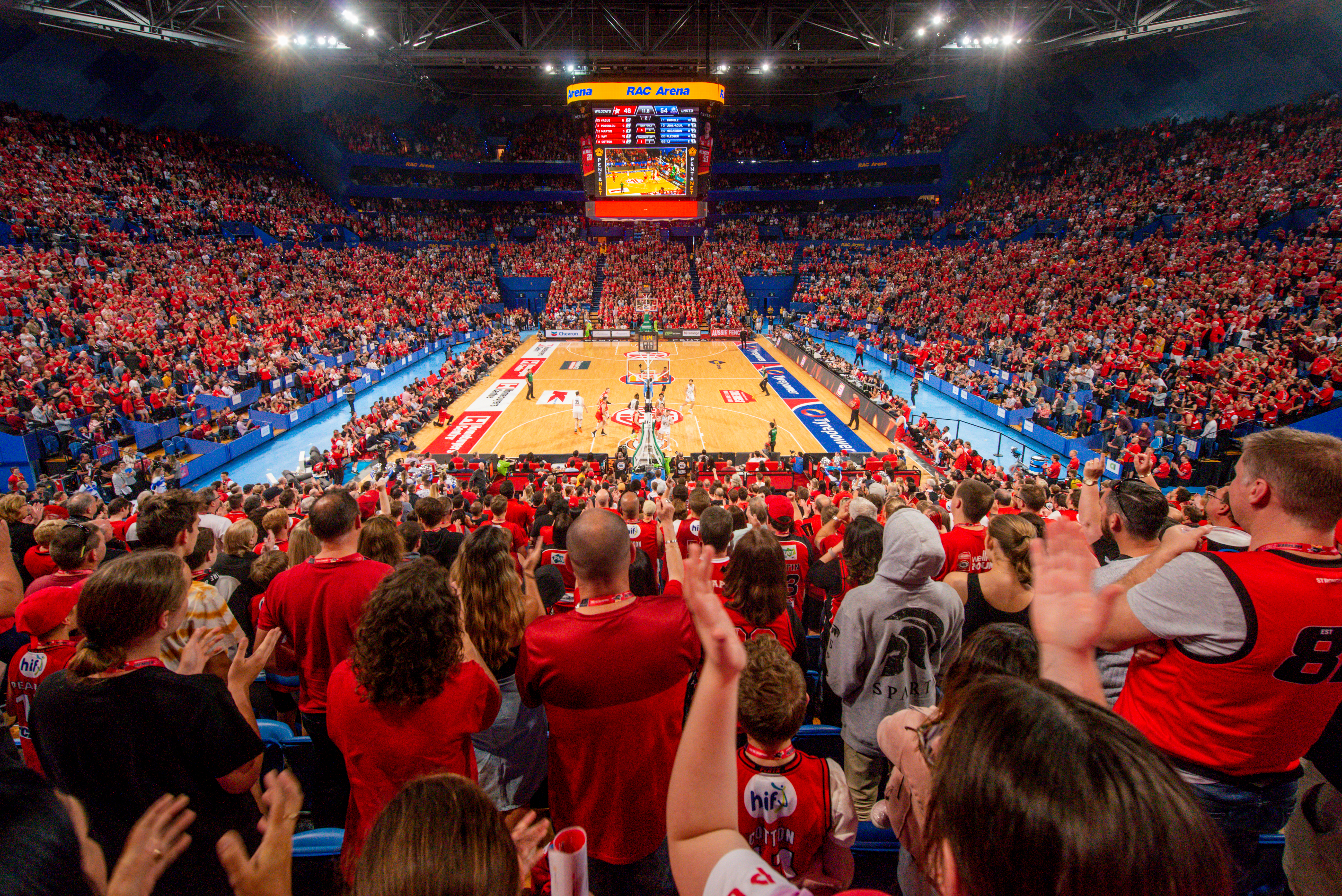 A photo taken from the crowd of a Perth Wildcats game being played on the court at RAC Arena in Perth