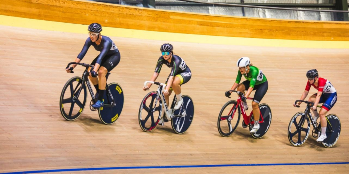 A photo of four riders competing in the Australian Track Cycling Championships held at the Speeddome in Middle Swan, Perth