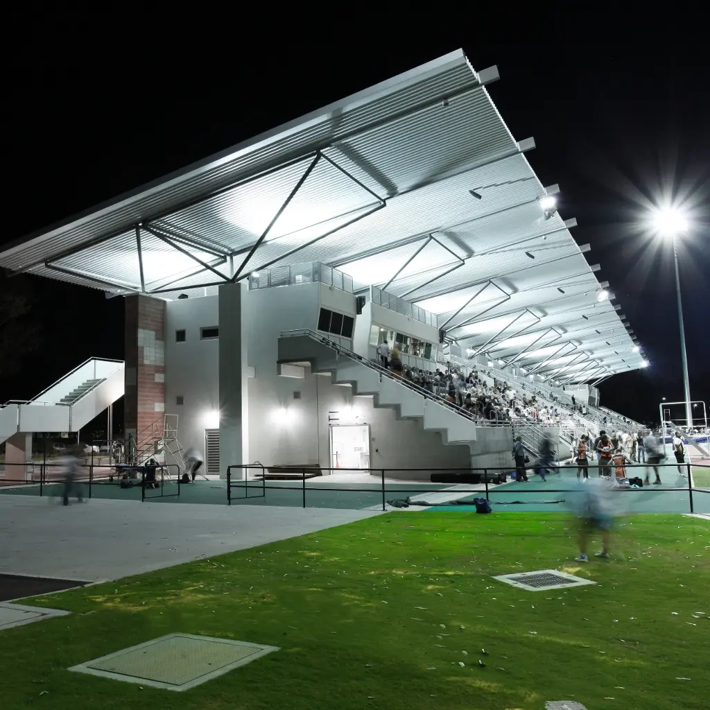 A close up photo of a catering kiosk with two shelves of food on display
