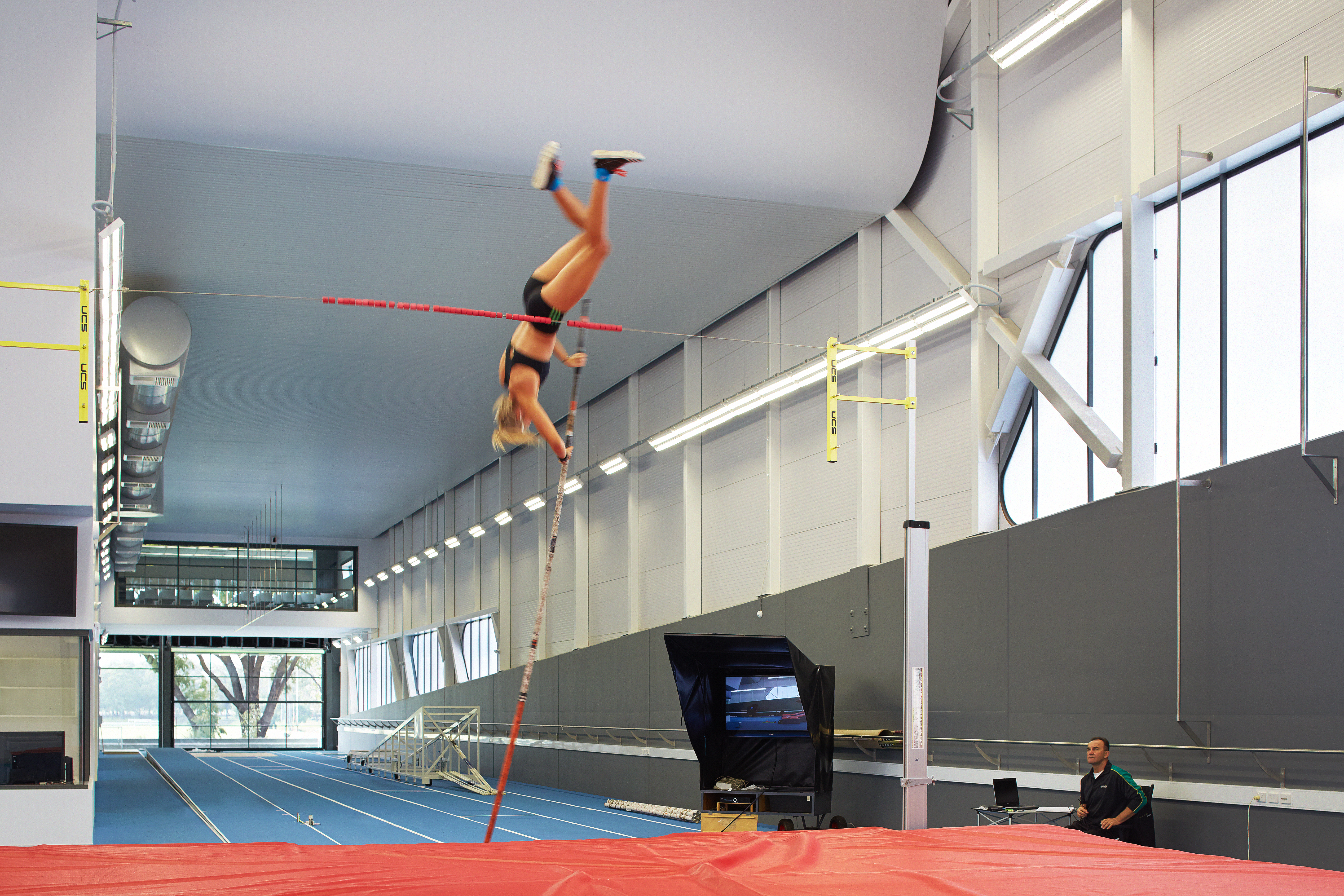 A photo of a pole vaulter mid jump at the WA Institute of Sport